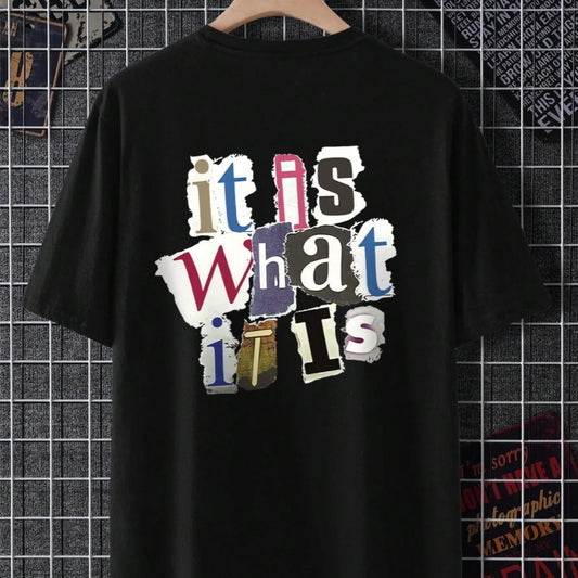 Black vintage slogan tee with colorful text design on a tiled wall background