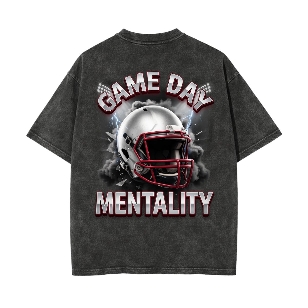 A dark gray acid-wash t-shirt shown from the back, featuring a graphic of a football helmet with smoke and the text 'GAME DAY MENTALITY' in white and red.