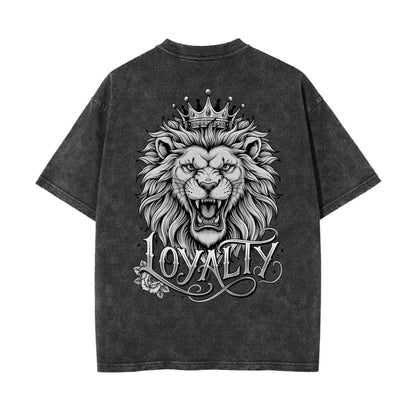 A dark gray mineral-wash t-shirt shown from the back, featuring a large graphic print of a lion wearing a crown with the word 'LOYALTY' written below in an ornate script.