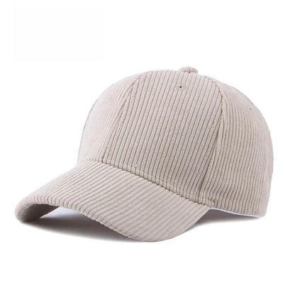 Beige yellow corduroy baseball cap on a white background