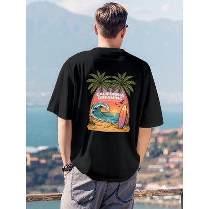 Black California Dreaming t shirt with palm trees wave and surfboard graphic