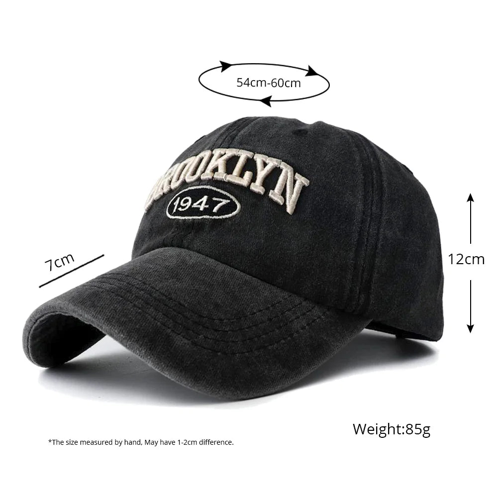 Black baseball cap with 'Brooklyn 1947' embroidery, shown with measurements on a white background.