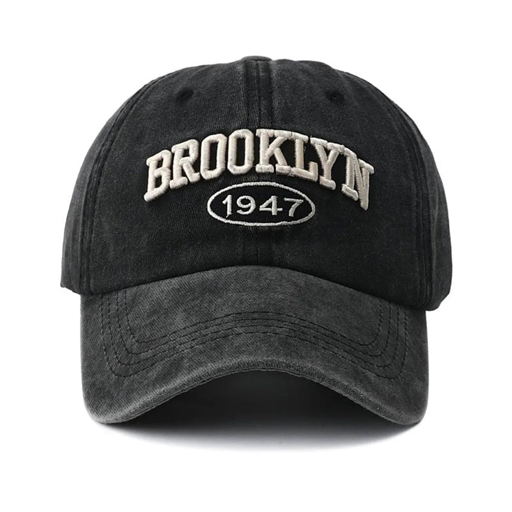 Black embroidery cap with 'Brooklyn 1947' text on a white background
