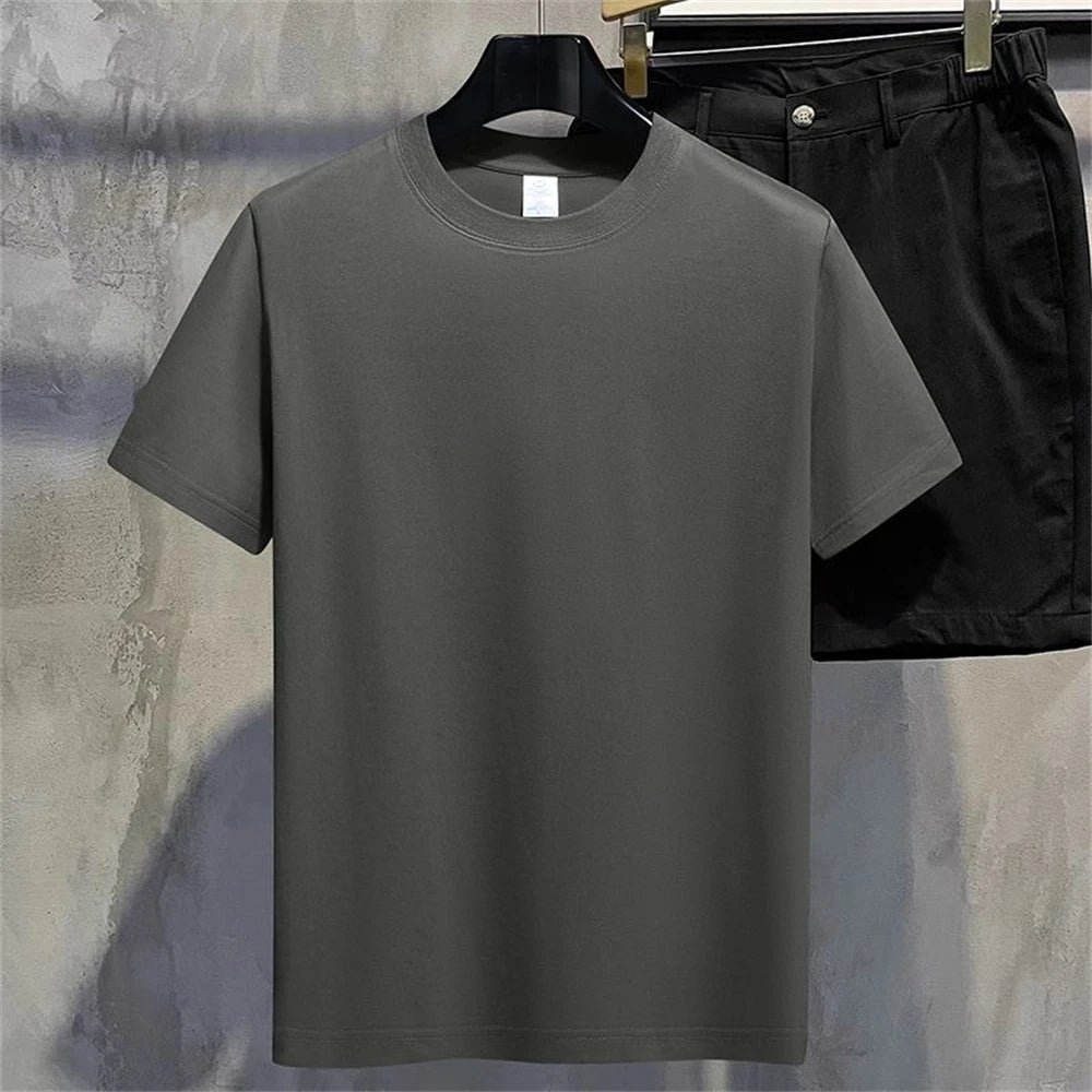 Dark Gray regular full plain t shirt on a hanger with black pants in the background