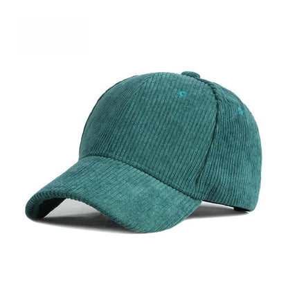 Dark green corduroy baseball cap on a white background