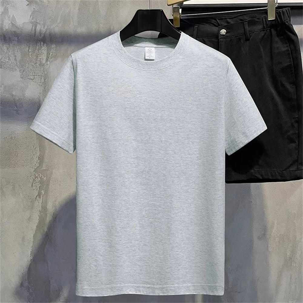 Gray full plain t shirt on a hanger with a blurred background