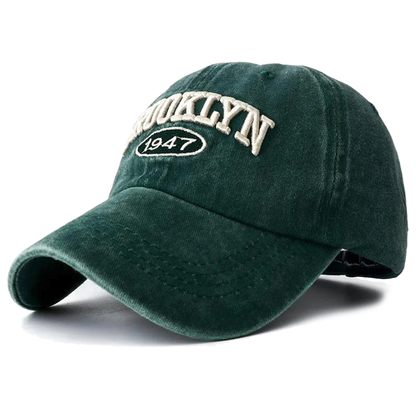 Green brooklyn baseball cap with 'Brooklyn 1947' text on a white background