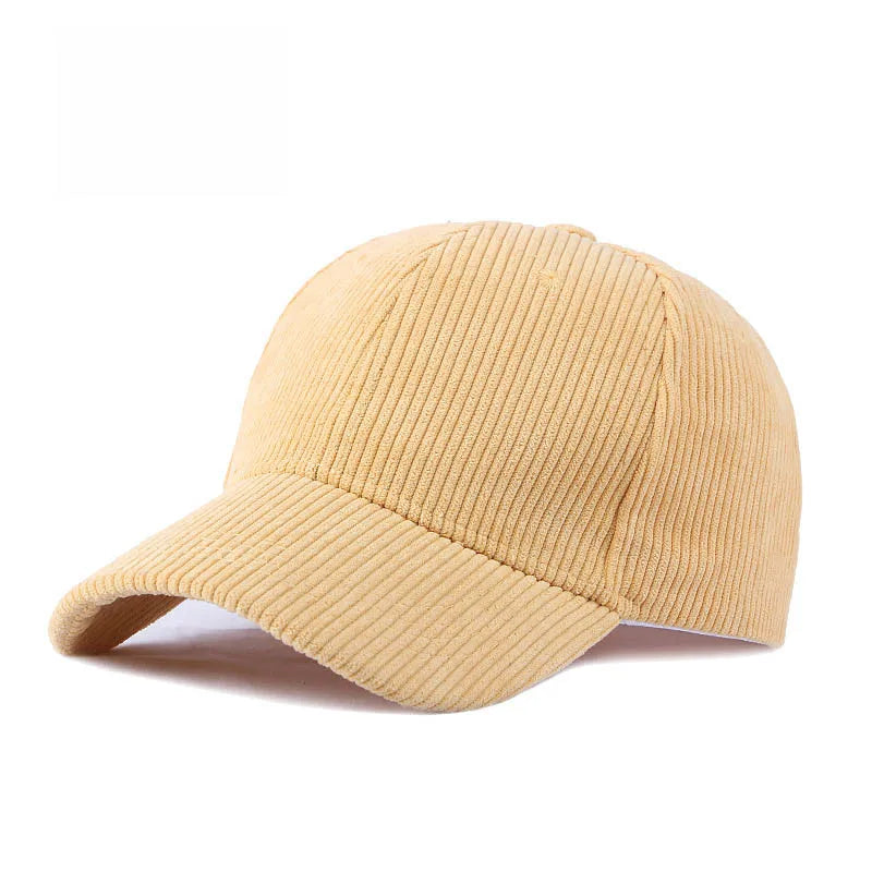 Light yellow corduroy baseball cap on a white background