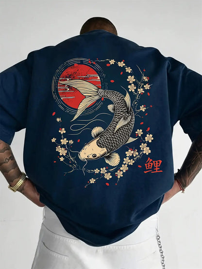 Person wearing a navy blue koi fish oversized t shirt with a koi fish design on the back