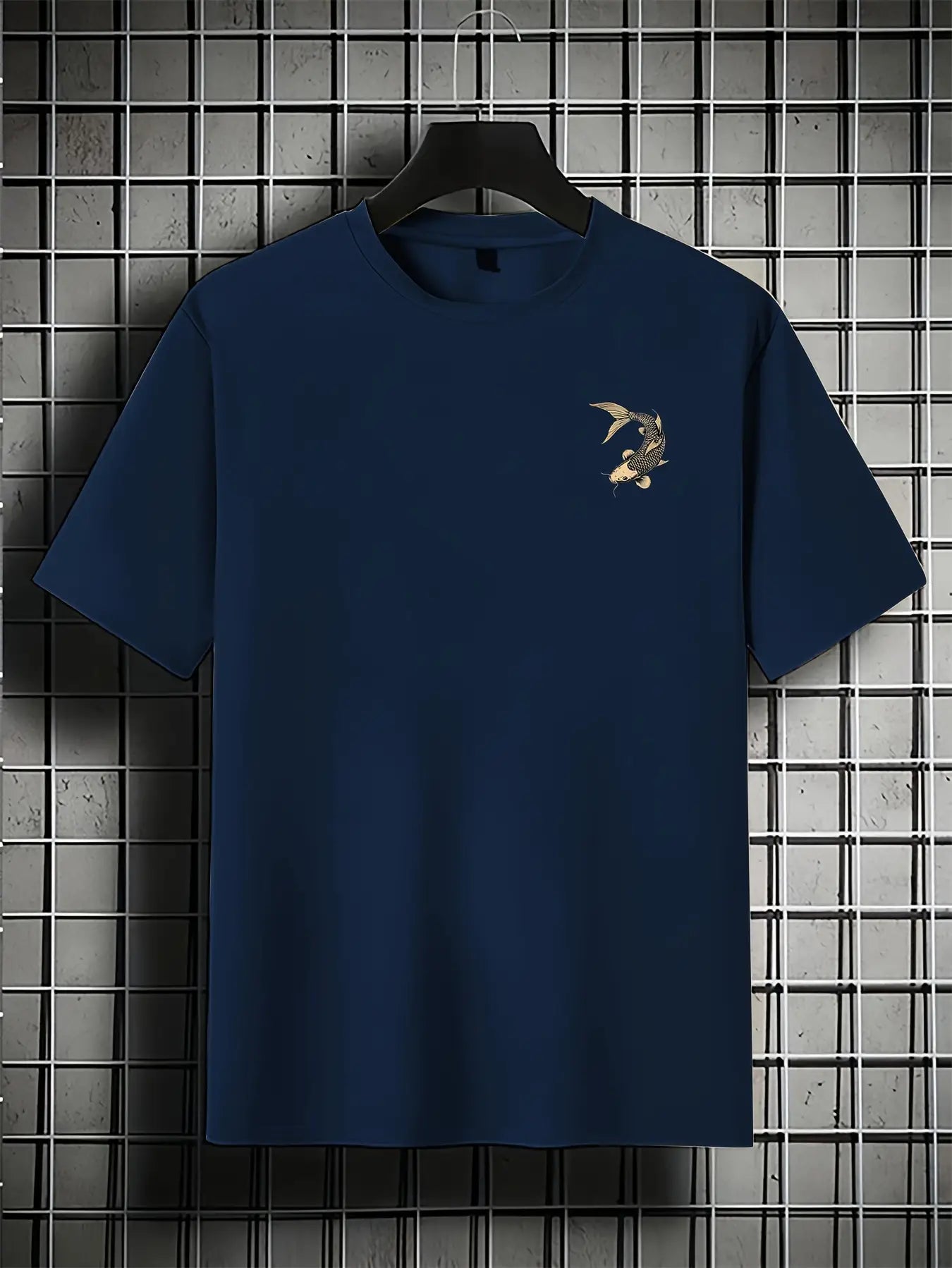 Navy blue koi fish oversized t shirt with a small logo on a hanger against a grid background
