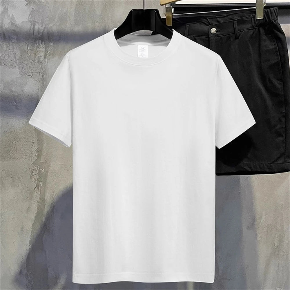 Regular full plain White t-shirt on a hanger with black pants in the background