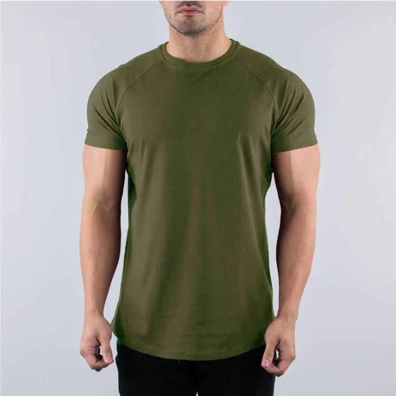 Person wearing an olive green t-shirt against a plain background