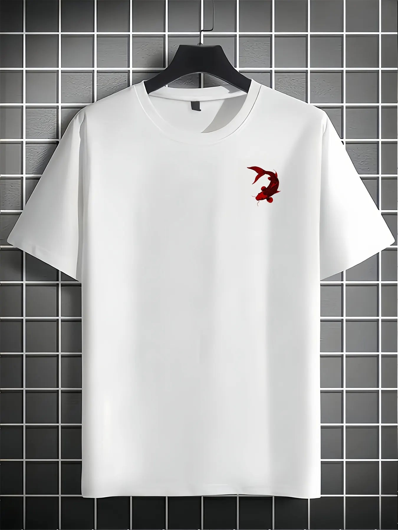 White koi fish t-shirt with a red logo on a hanger against a tiled wall background