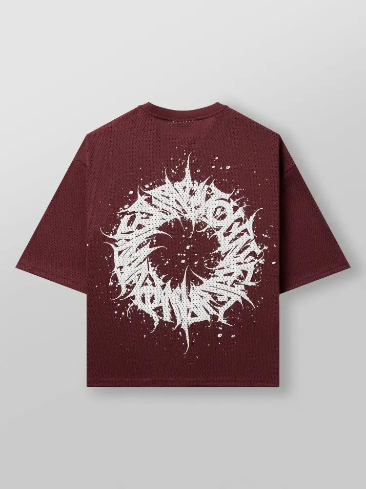 oversized red graphic tee with a white abstract maelstrom design on back of the t shirt against a light gray background