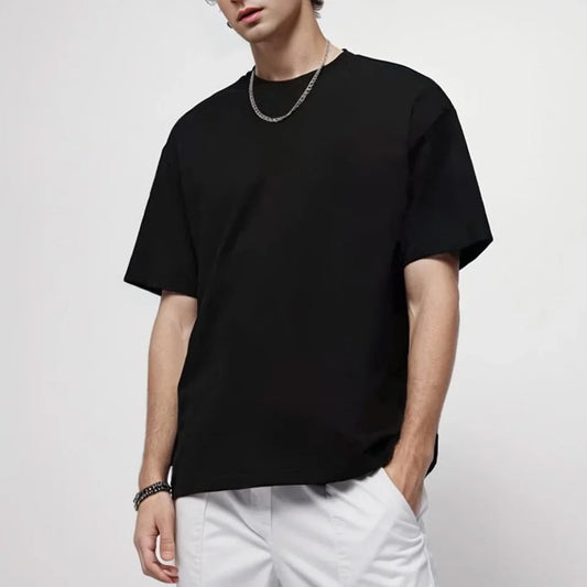 Person featuring a ultra weight  plain oversized black  t shirt