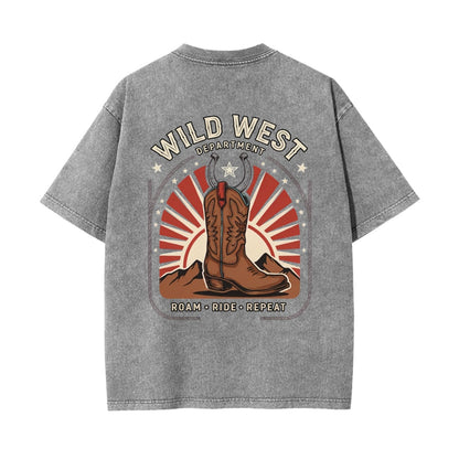 A gray washed short-sleeve t-shirt shown from the back, featuring a large 'Wild West Department' graphic with a cowboy boot, mountains, and red sunburst design.